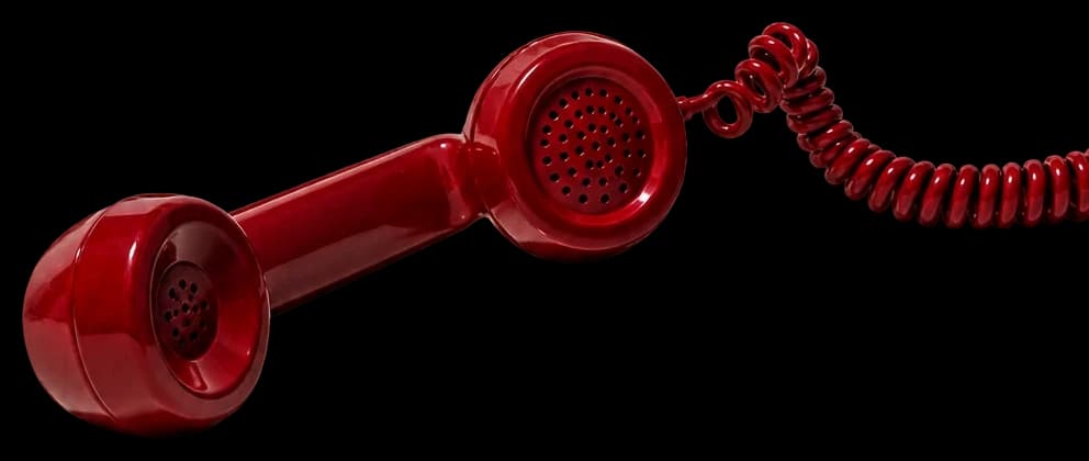 Red telephone handset, off the hook